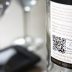 A wine bottle with the QR code showing